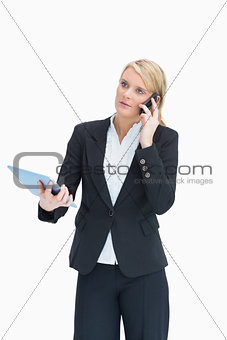 Woman using cell phone and tablet