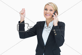 Woman celebrating on phone