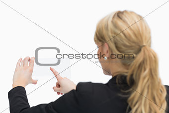 Woman touching pane
