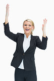 Cheerful woman raising her hands