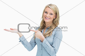 Woman pointing at her hand