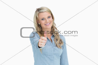 Woman giving thumbs up sign