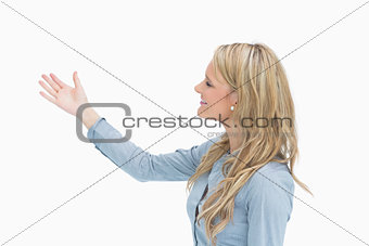 Woman presenting cheerfully