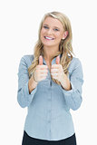 Smiling woman doing thumbs up