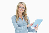 Smiling woman touching on tablet