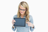 Woman showing tablet and pointing on it