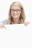 Woman wearing glasses and pointing on the paper