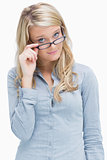 Woman looking above her glasses