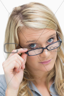 Blonde looking above her glasses