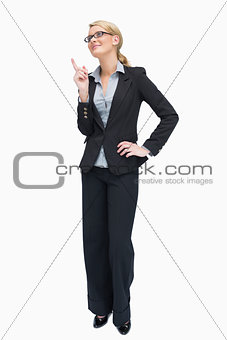 Smiling businesswoman thinking