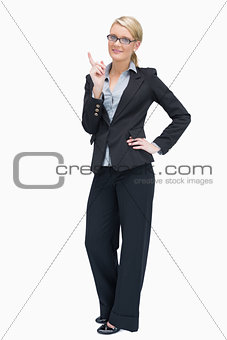 Thinking businesswoman standing