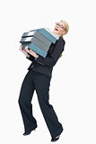 Businesswoman carrying folders