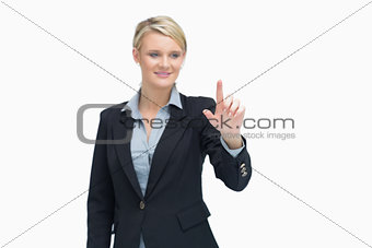 Smiling businesswoman indicating