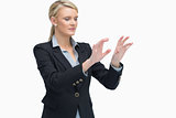 Standing businesswoman lifting hands