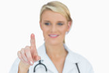 Smiling doctor pointing