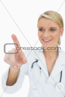 Smiling doctor touching on something