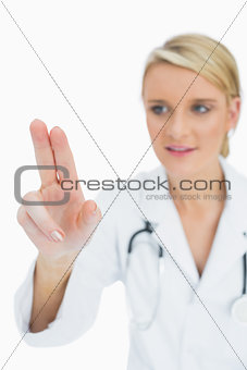 Doctor touching on something with two fingers