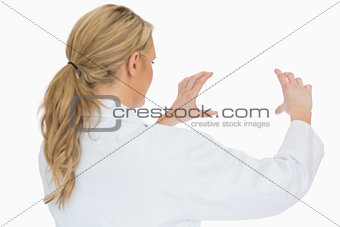 Doctor holding glass slide from behind