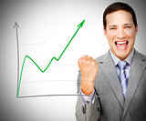 Businessman celebrating behind increasing graph