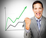 Businessman standing smiling behind graph