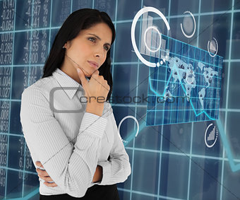 Woman standing thinking and looking at world map
