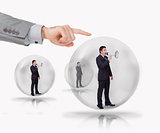 Three businessmen standing in bubble with megaphone