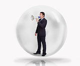 Businessman with megaphone in a bubble