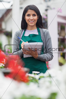 Woman checking plants