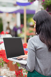 Florist using a laptop