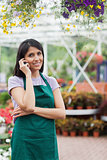 Florist doing a phone call while smiling