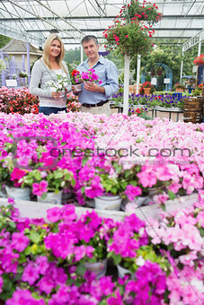 Couple standing in garden center