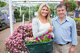 Smiling couple buying plants