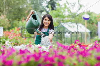 Happy employee watering plants