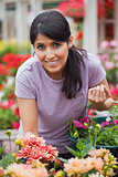 Cheerful woman shopping for flowers
