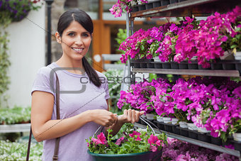 Woman buying pink flowers