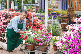 Man putting flowers in trolley