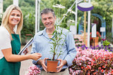 Gardener giving advice to customer