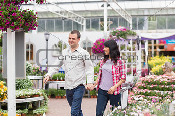 Couple walking through a garden center