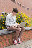 Student using laptop outside