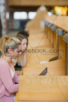 Woman studying with tablet pc