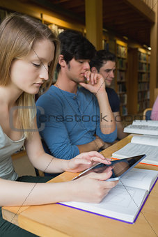 Woman in study group using tablet pc