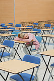 Student napping in exam hall