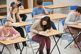 Students writing in the exam hall