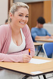 Girl sitting at desk smiling