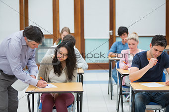 Lecturer explaining something to student