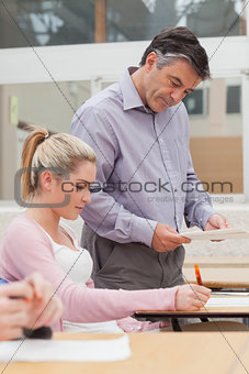 Lecturer checking students work