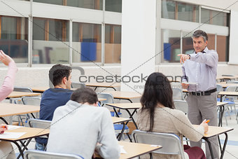 Teacher pointing at student asking question