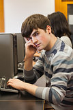 Student looking tired in computer room