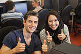 Happy students giving thumbs up