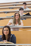 Students sitting smiling in lecture hall